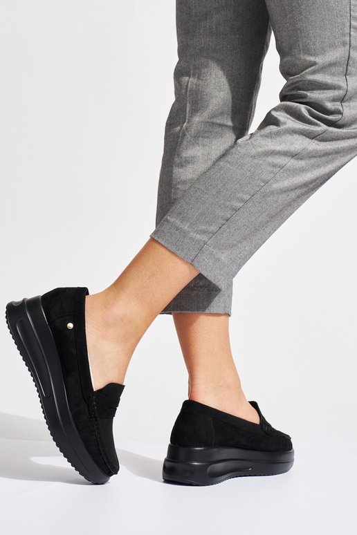 of suede black INomens moccasins on a...