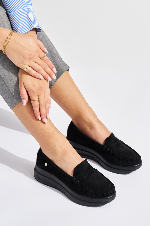 of suede black INomens moccasins on a...