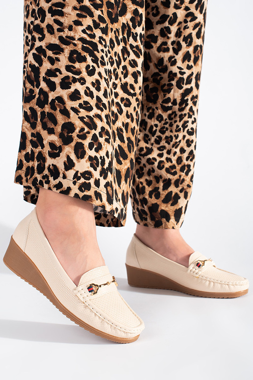 cream colors INomens moccasins on a... cream colors INomens moccasins on a...