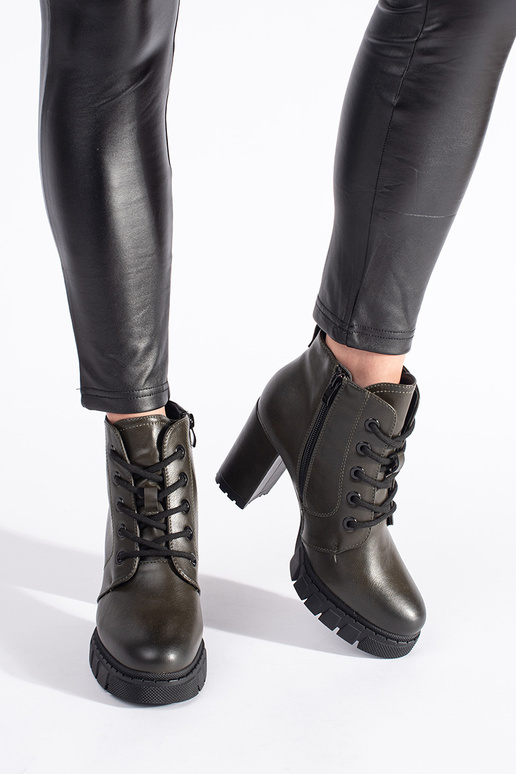 khaki colors Inomens boots on a high...