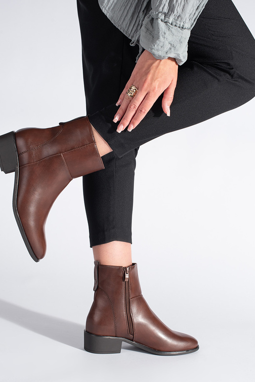Leather BroInn color boots above the...