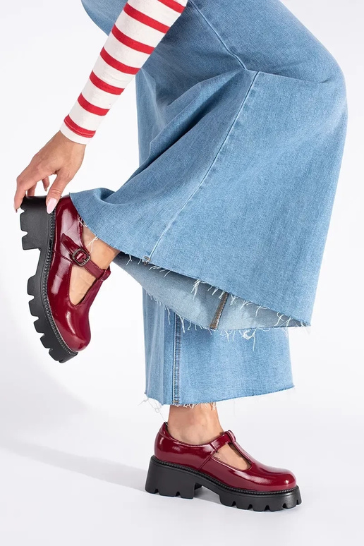 burgundy lacquered INomens boots...