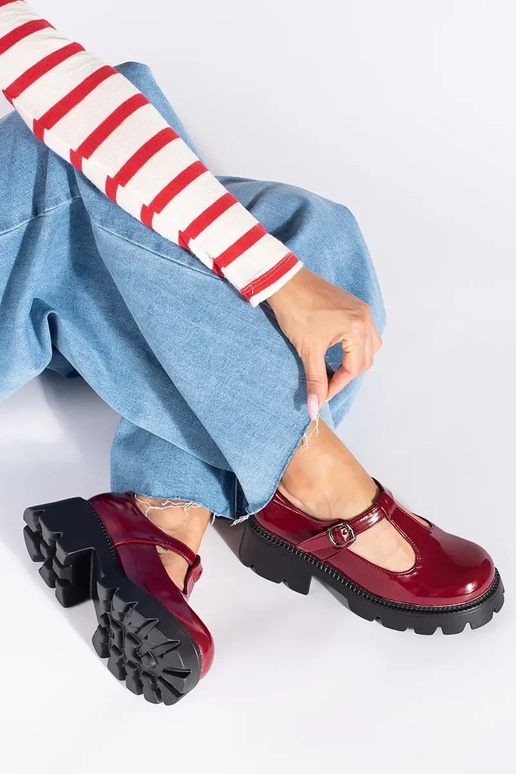 burgundy lacquered INomens boots...