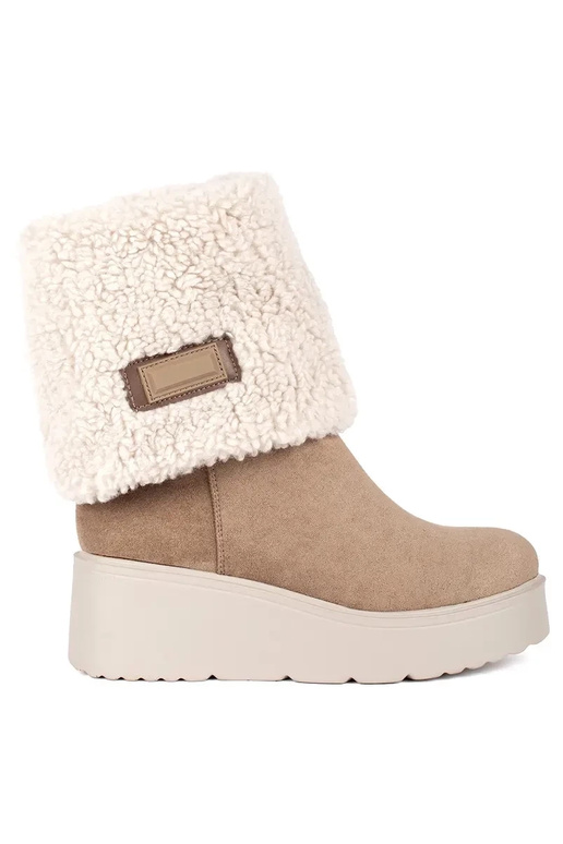 beige insulated Inomens boots on a...