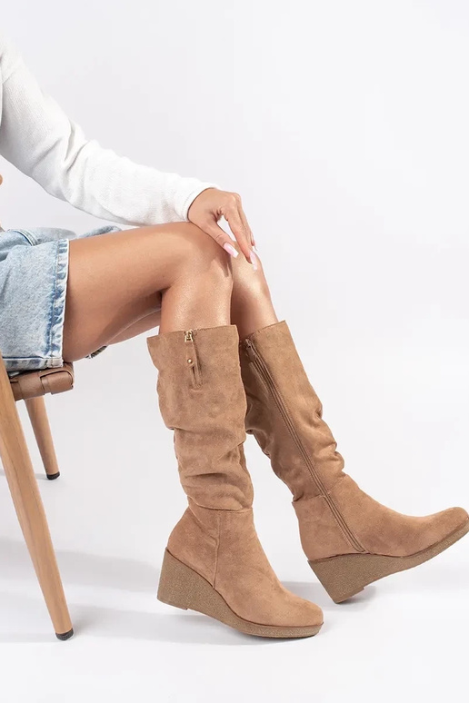 Beige suede long boots on platform