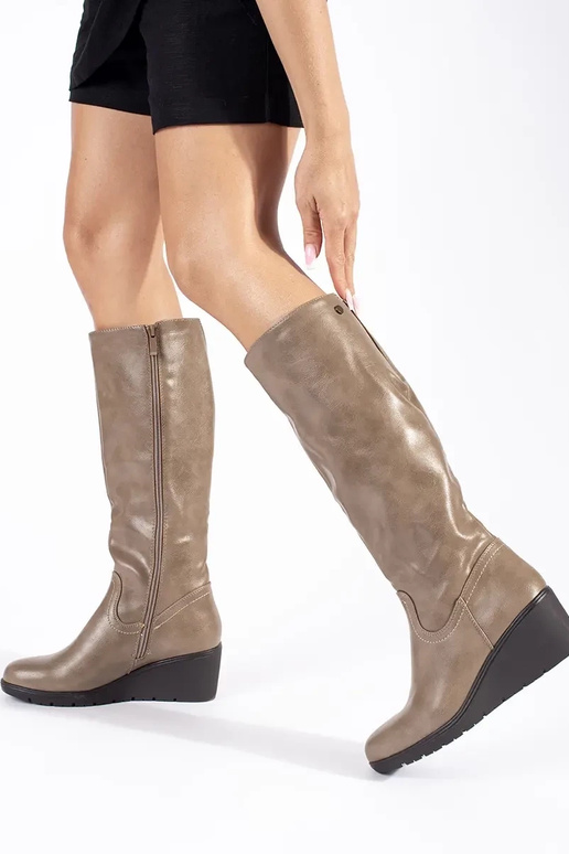 Beige long boots with a platform
