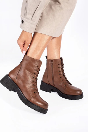 Brown shoes with a thick... 2