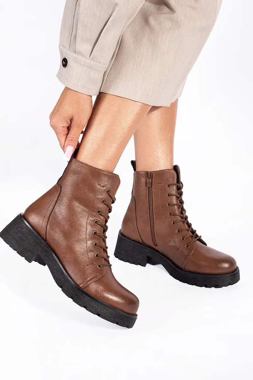 Brown shoes with a thick sole by...