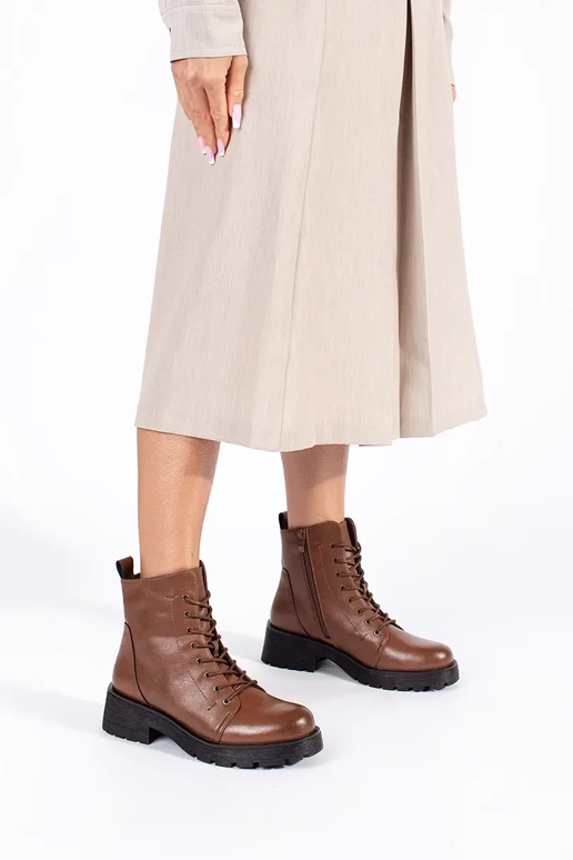 Brown shoes with a thick sole by...