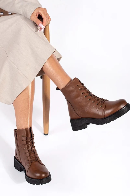 Brown shoes with a thick sole by...