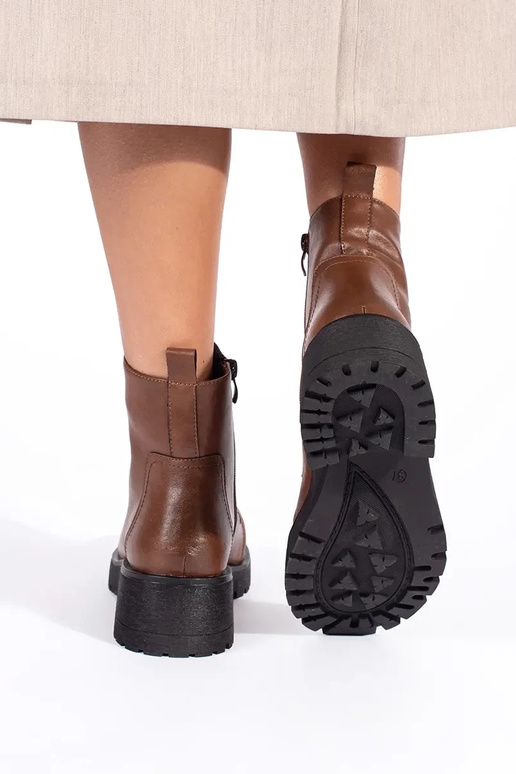 Brown shoes with a thick sole by...