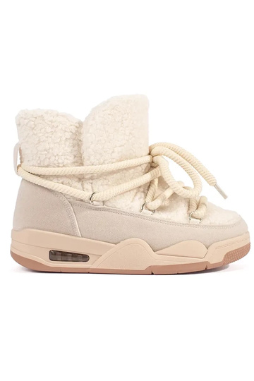 Beige women's snow boots on...