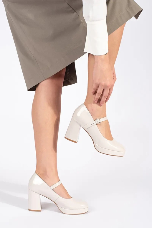 Beige patent women's heeled ankle...