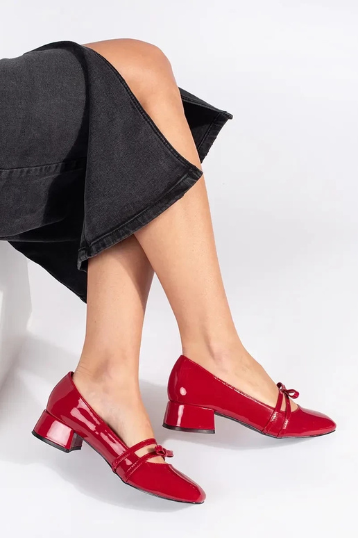 red lacquered High heels on a loIn heel