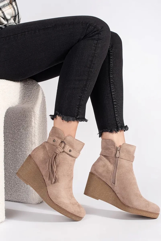 of suede beige Inomens boots on a...