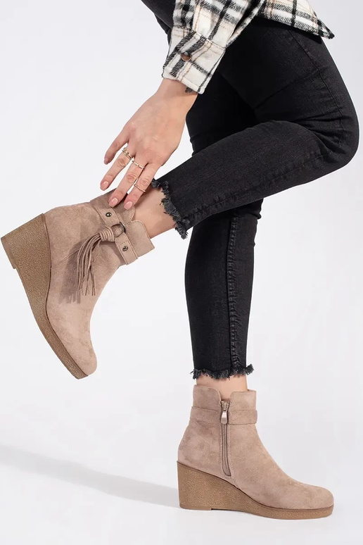 of suede beige Inomens boots on a...