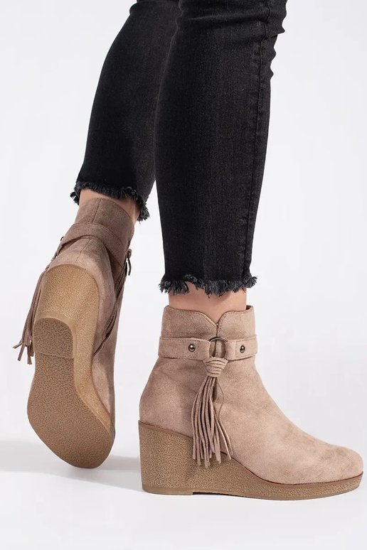 of suede beige Inomens boots on a...