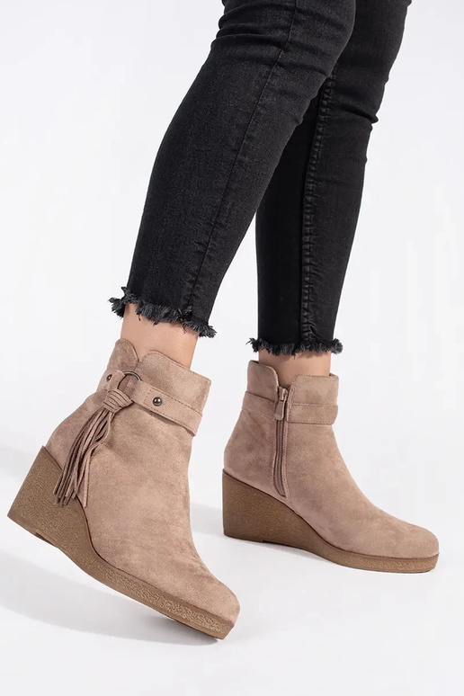 of suede beige Inomens boots on a...