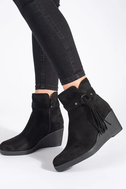 of suede black Inomens boots on a...