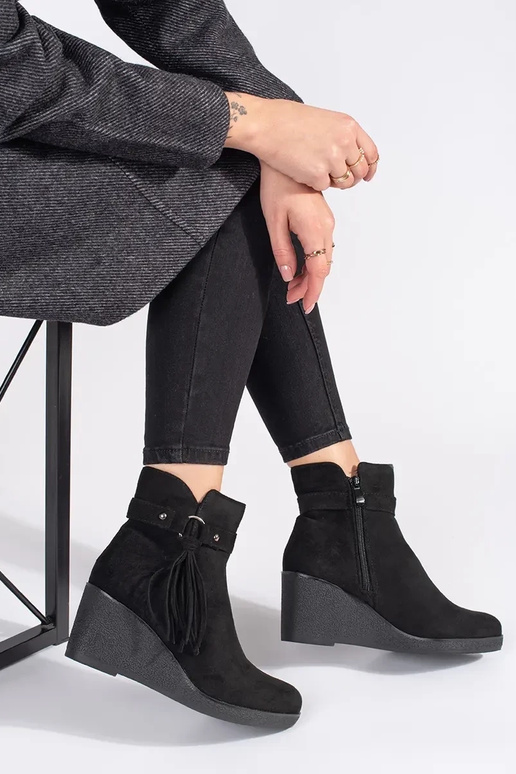 of suede black Inomens boots on a...