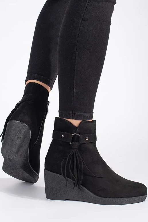 of suede black Inomens boots on a...