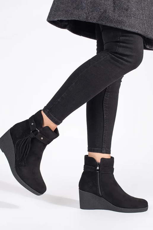 of suede black Inomens boots on a...