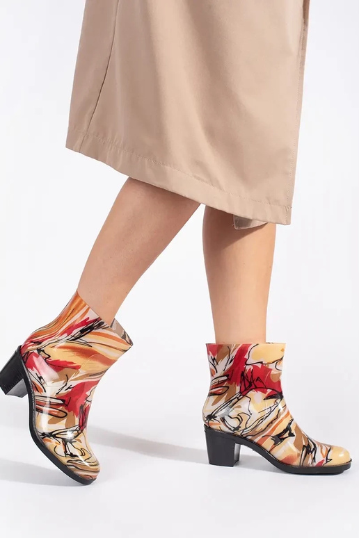 Different colors rubber shoes on...