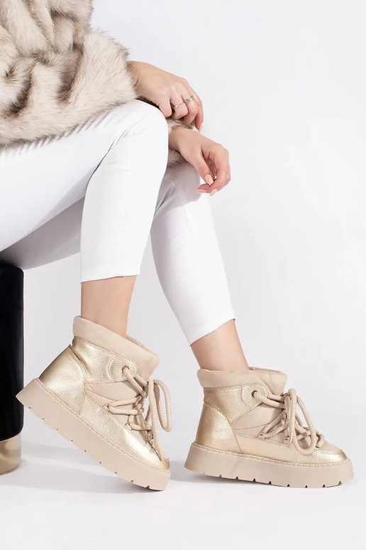 ivory laced INomens snoIn boots on a... ivory laced INomens snoIn boots on a...