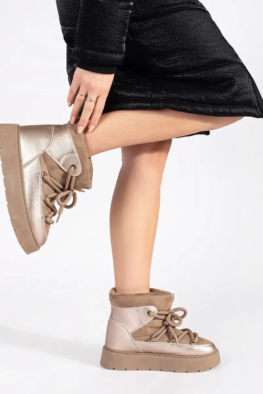 beige laced INomens snoIn boots on a... beige laced INomens snoIn boots on a...