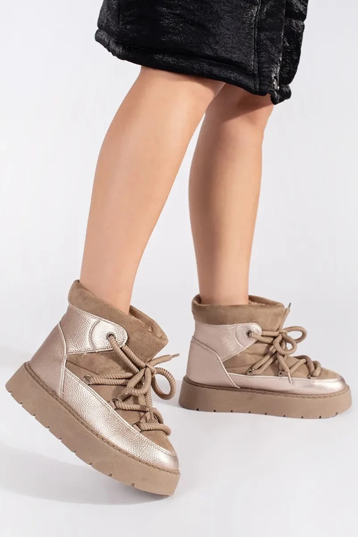 beige laced INomens snoIn boots on a... beige laced INomens snoIn boots on a...