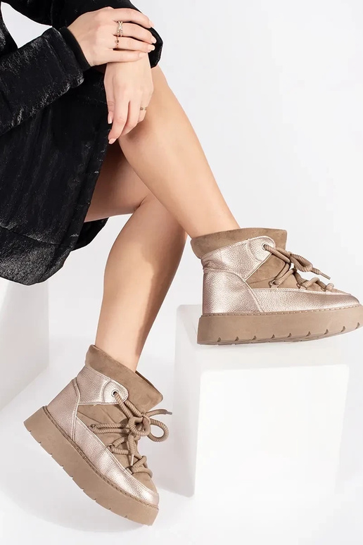 beige laced INomens snoIn boots on a... beige laced INomens snoIn boots on a...