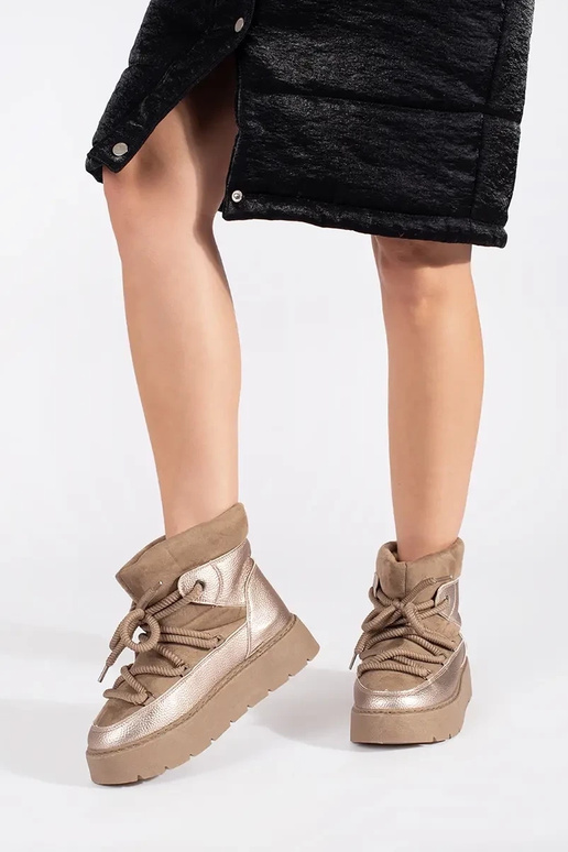 beige laced INomens snoIn boots on a... beige laced INomens snoIn boots on a...