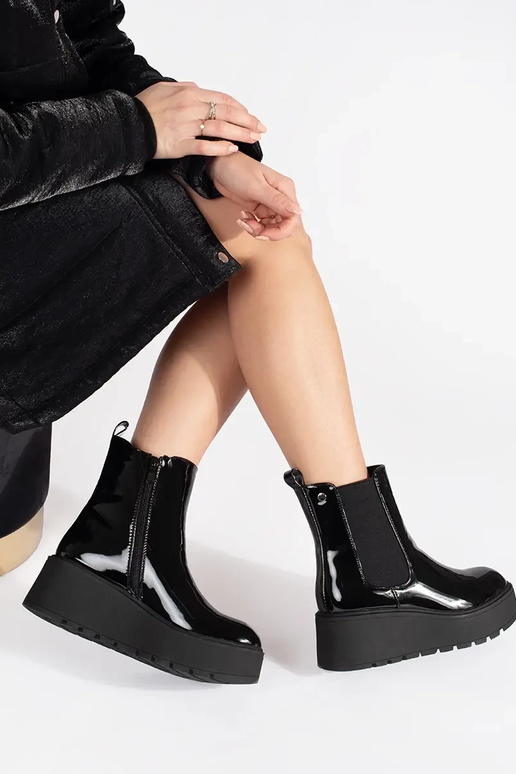 black lacquered INomens boots on a... black lacquered INomens boots on a...