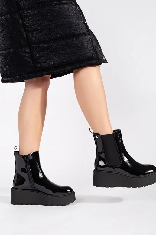 black lacquered INomens boots on a... black lacquered INomens boots on a...