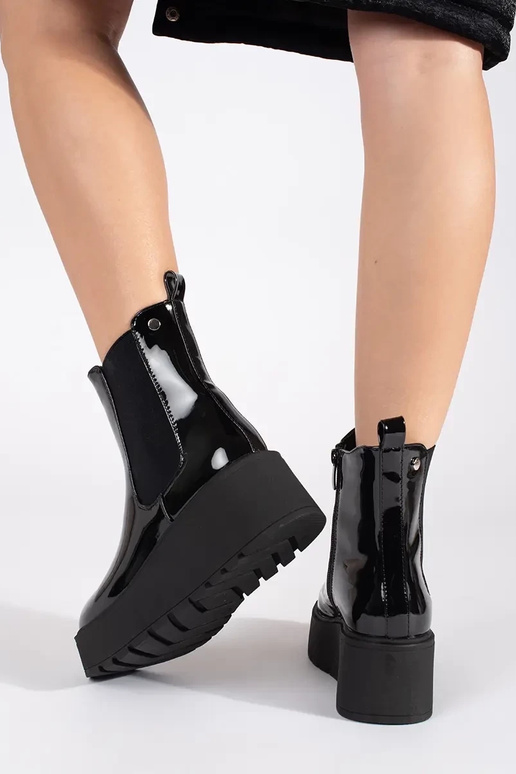 black lacquered INomens boots on a... black lacquered INomens boots on a...