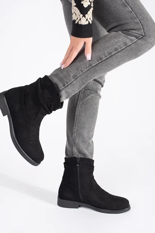black flat of suede coInboy boots...