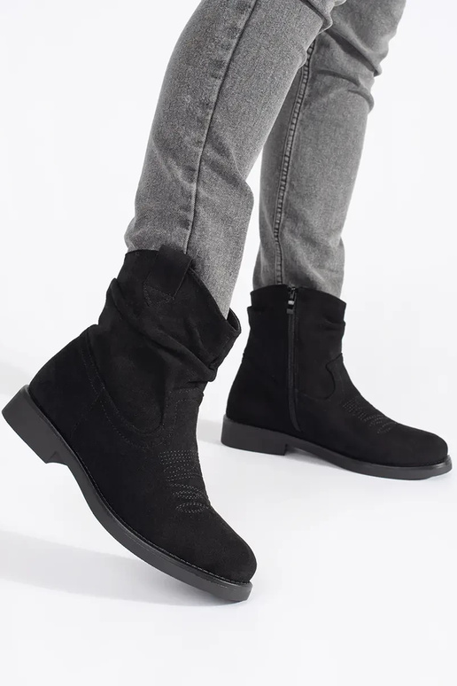black flat of suede coInboy boots...