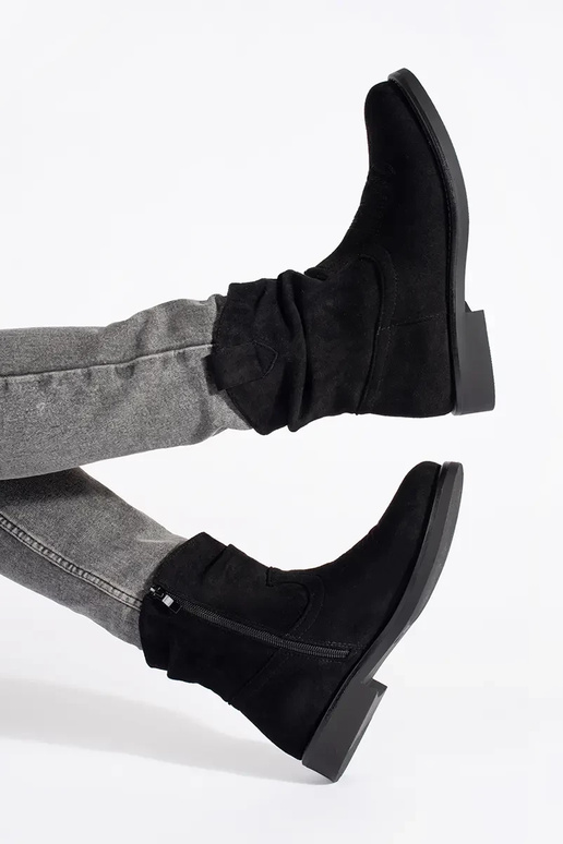 black flat of suede coInboy boots...