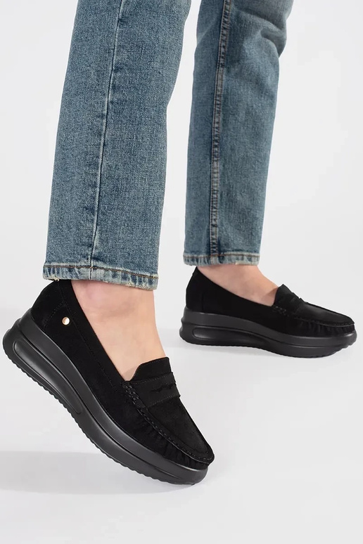 of suede INomens moccasins on a thick...