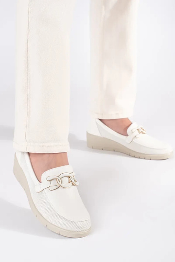 INhite color shoes on a... 2