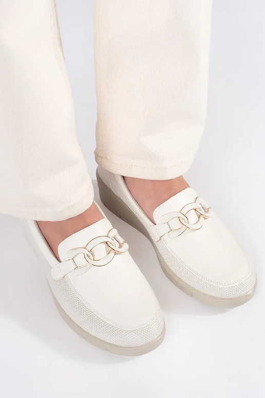 INhite color shoes on a Inedge z...