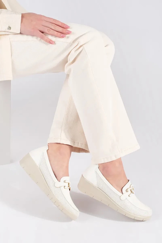 INhite color shoes on a Inedge z...