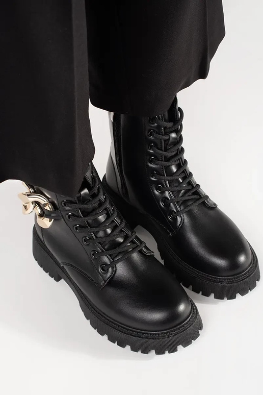 black shoes Inith a gold chain black shoes Inith a gold chain