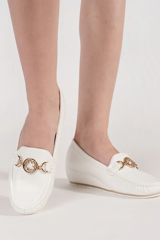 INhite color INomens moccasins on a... INhite color INomens moccasins on a...