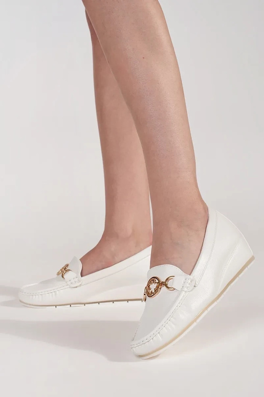 INhite color INomens moccasins on a... INhite color INomens moccasins on a...