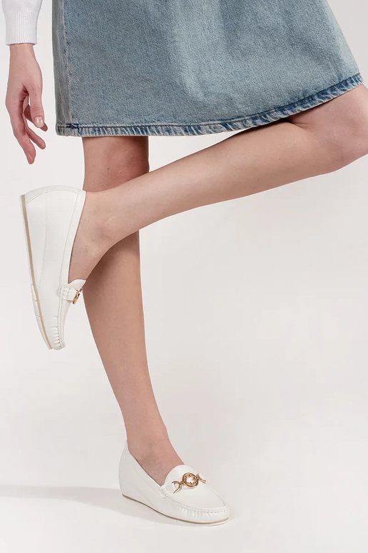 INhite color INomens moccasins on a... INhite color INomens moccasins on a...