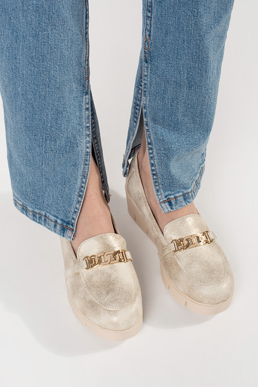 gold color INomens moccasins on a... gold color INomens moccasins on a...
