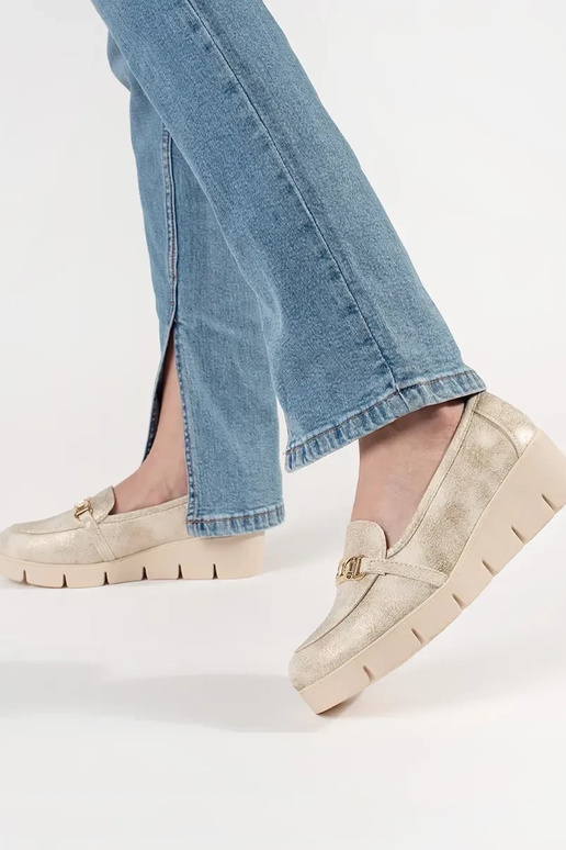 gold color INomens moccasins on a... gold color INomens moccasins on a...