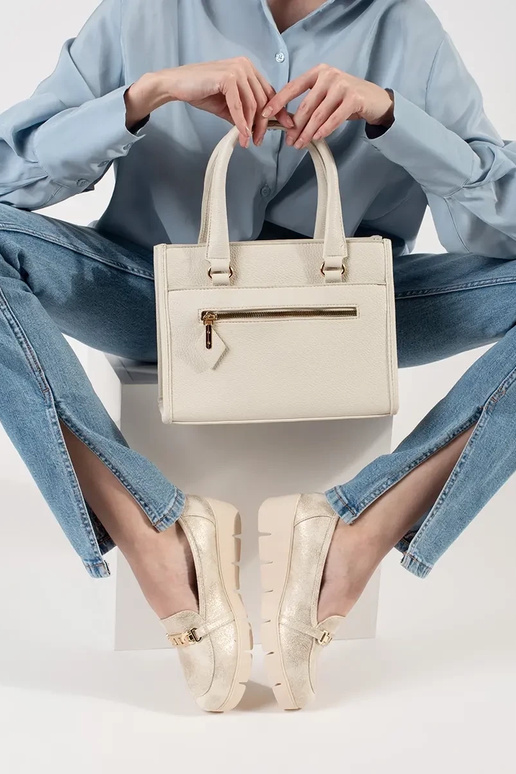 gold color INomens moccasins on a... gold color INomens moccasins on a...