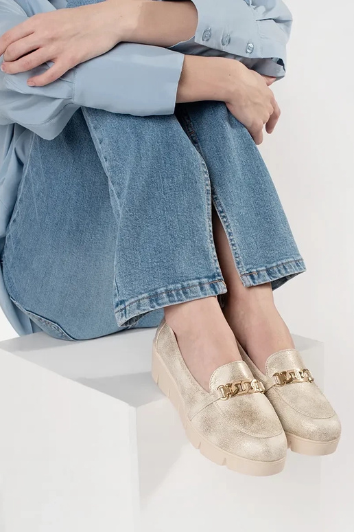 gold color INomens moccasins on a... gold color INomens moccasins on a...